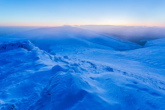 Snow drift formations on the top of the Galty Mountains covered in snow at dawn; County Tipperary, Ireland