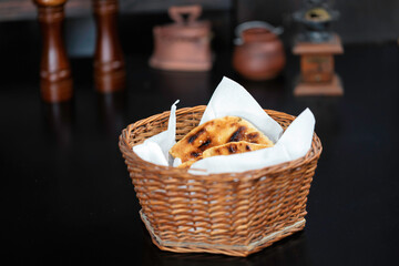 Warm and fragrant bread fresh from the oven, pita bread, a staple of Middle Eastern or Balkans cuisine. A variety of delicious bakery treats on display