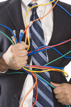 Close-up of Businessman Holding CAT5 Cables