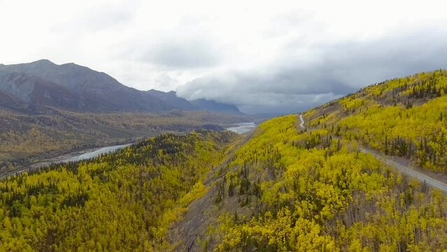 Autumn view of valley near Matanuska River in Alaska. Cloudy day in Chugach National Forest.
