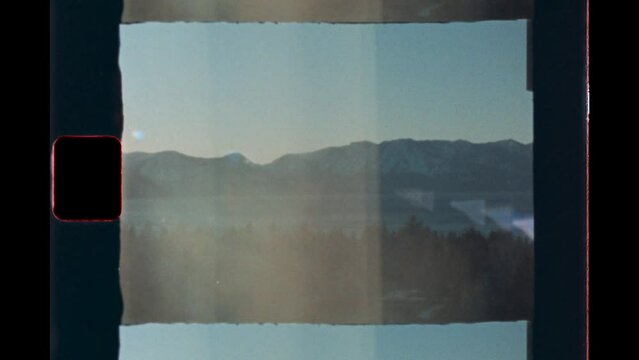 Vintage travel 8mm super 8 film footage of mountains in lake tahoe