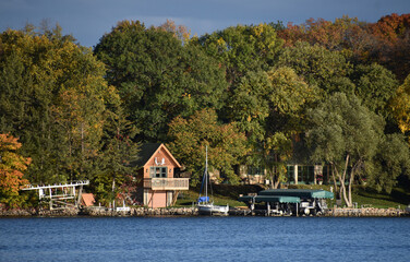 cloudy blue sky over a peaceful minnesota lake shore