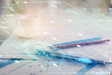 Double exposure of table with computer on background and data theme hologram. Data technology concept.