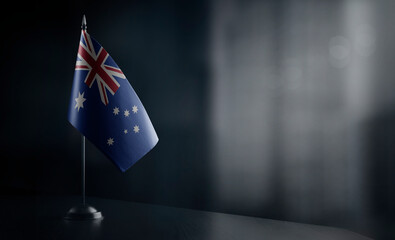 Small national flag of the Australia on a black background - Powered by Adobe