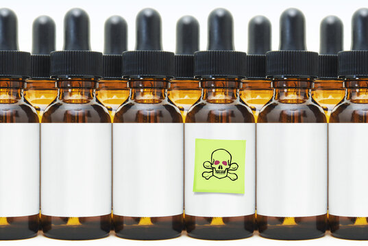 Rows of Eye Dropper Bottles with One Marked Poison