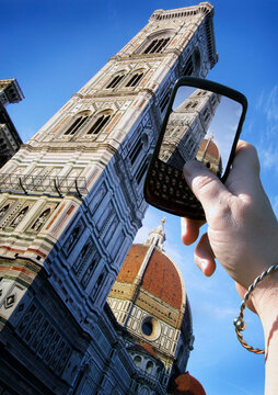 Woman's Hand Taking Photo of Basilica di Santa Maria del Fiore, Florence, Italy