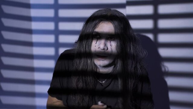 The cowardly and nervous emo teenager. 
The teenager with the emo lifestyle looks confused and agitated.
