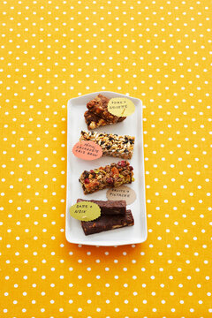 Energy Bars on Tray with French Labels on Polka-dot Background