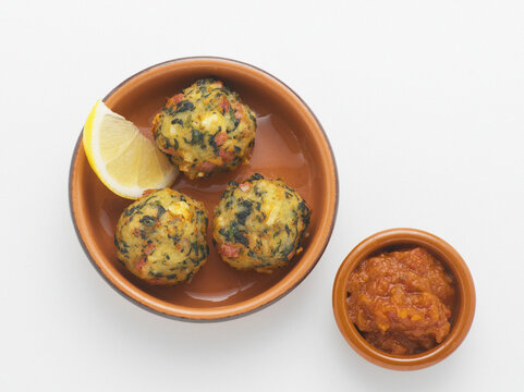 Fried Potatao Balls with Lemon Wedge and Bowl of Salsa, Studio Shot
