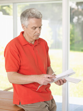 Man Holding Envelope