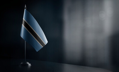 Small national flag of the Botswana on a black background