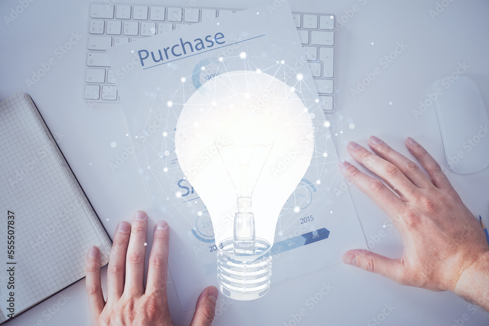 Poster view of bulb lamp idea concept icon on a futuristic interface with writing man's hand background. do