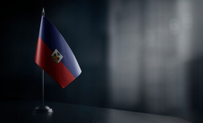 Small national flag of the Haiti on a black background