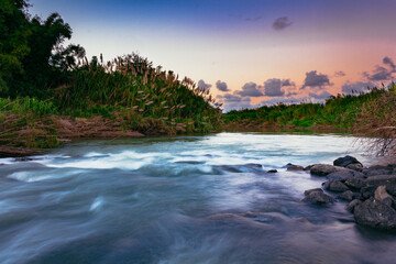 Sunset in the big river of Arecibo Puerto Rico in the middle of the forest