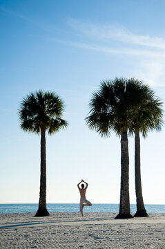 Man Practicing Yoga on Beach, Hernando Beach, Florida, USA