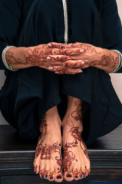 Close-up of Woman's Hands and Feet with Henna in Arabic Style