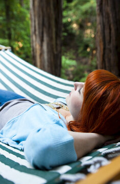 Woman in Hammock in Redwood Trees, Santa Cruz County, California, USA