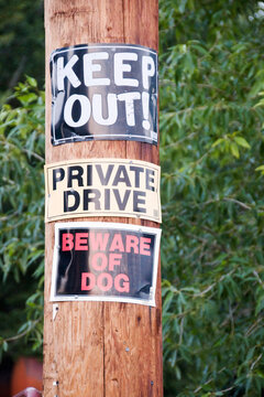 Warning Signs on a Pole