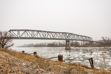 Brownville bridge over the massive and icy Missouri river during the winter