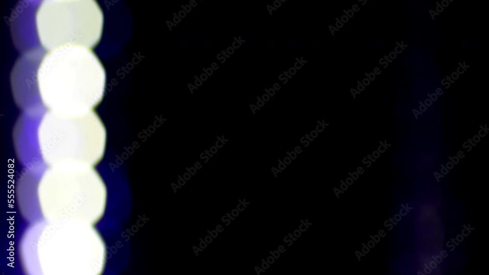 Wall mural blue round bokeh falling frame. loop 4k video. blue and white bokeh fall down in a row. can be used 