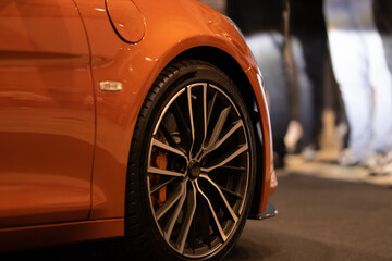 Wheels of the tire of the sports orange car
