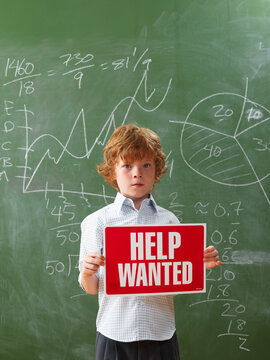 Boy Holding Help Wanted Sign