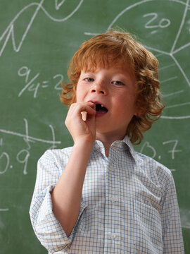 Portrait of Boy Pulling Front Teeth