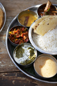 Thali, Kadai Bhindi, Mixed Vegetable Curry, Sambhar, Saag Paneer, Payasam, and Chapati