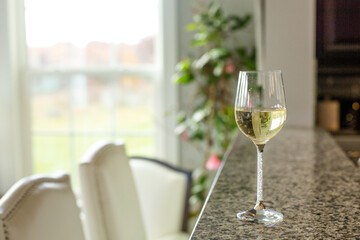 Isolated closeup glass of white wine in luxurious lifestyle home environment