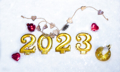 christmas background for 2023 with numbers, heart cones and christmas balls on snow. Holiday eve. Greeting card. Merry Christmas and New Year. place for text