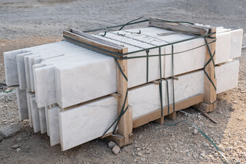 Pallet of marble, building material. Rock Blocks, Grey Shapes. New for use on construction site in...