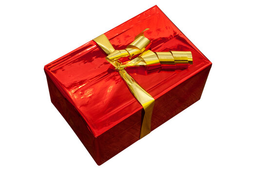 Beautiful red gift package wrapped in glossy paper and gold bow and cropped for image montages.