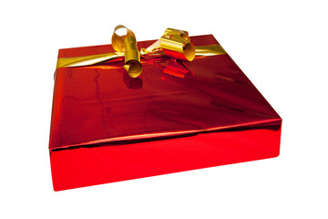Beautiful red gift package wrapped in glossy paper and gold bow and cropped for image montages.