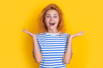 amazed redhead girl face isolated on yellow background. face of young redhead girl in studio.