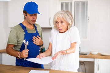 Elderly housewife expresses dissatisfaction with bill of the plumber