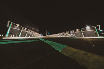 illuminated pedestrian bridge at night