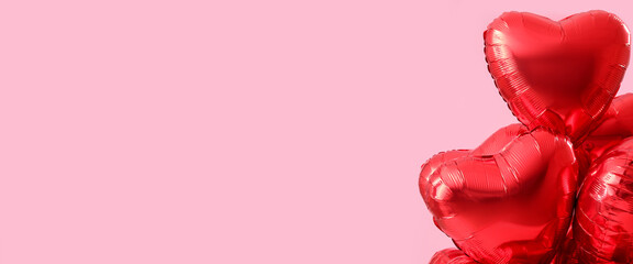 Beautiful heart-shaped balloons for Valentine's Day celebration on pink background with space for text