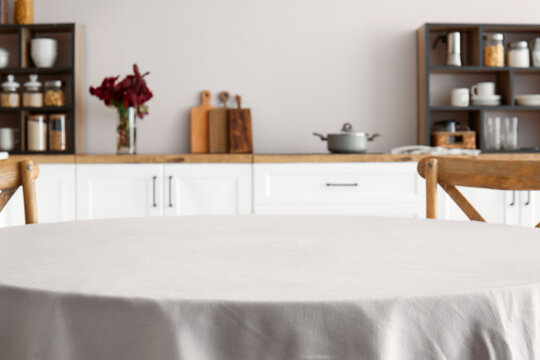 Empty dining table in light kitchen