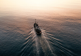Small Fishing Boat catch fish, aerial Top View from drone. Industrial commercial fishing. - obrazy, fototapety, plakaty