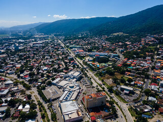Beautiful aerial view of the City of San Salvador, capital of El Salvador - Its cathedrals and buildings - obrazy, fototapety, plakaty