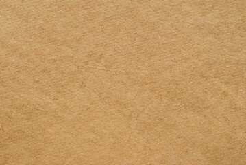 A sheet of old brown recycled subtle paper texture as background