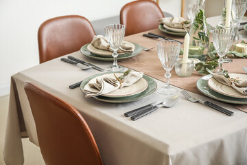 Beautiful setting with eucalyptus branches on served table