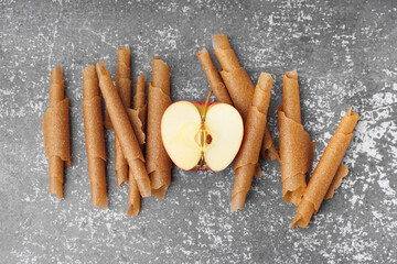 Tasty apple pastilles on grunge background