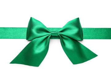 Green ribbon with beautiful bow on white background, closeup