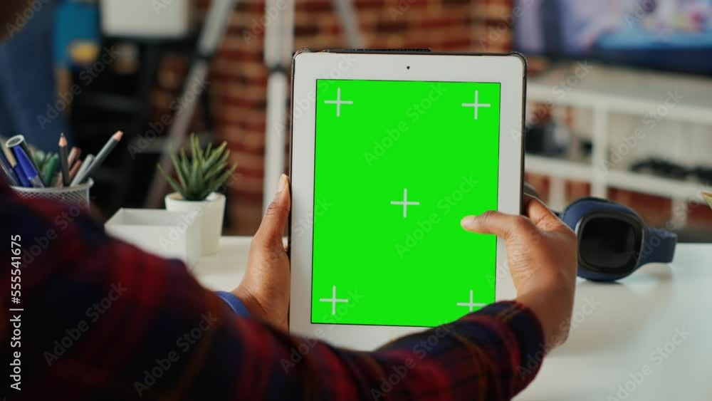 Poster young student using greenscreen template on digital tablet, analyzing isolated copyspace display on 