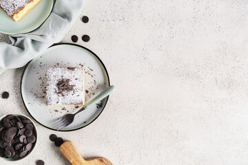 Plate with piece of cheese pie and fork on light background
