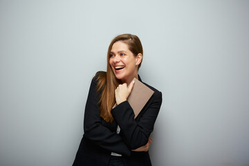 Happy woman teacher or student holding book. Isolated portrait with copy space.