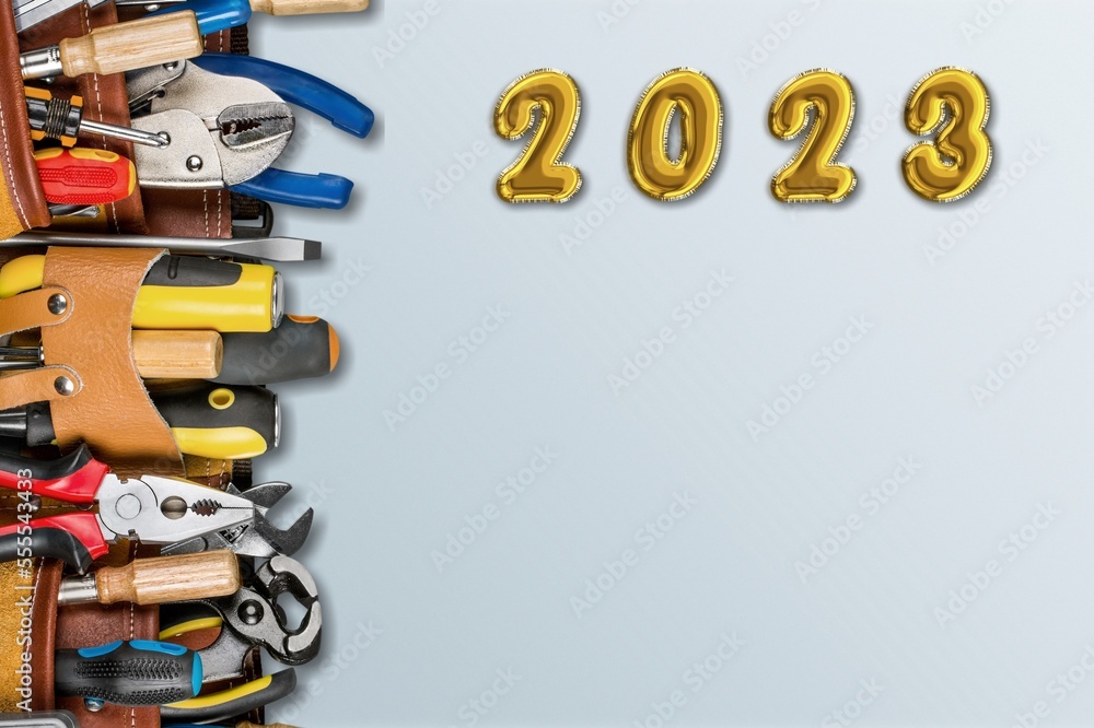 Wall mural 2023 numbers for new year and construction tools