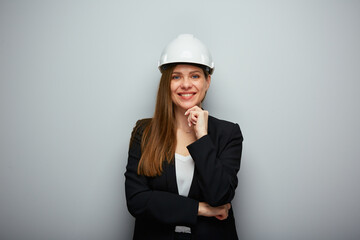 Woman architect or engineer in white helmet. Isolated female portrait.