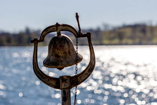 old rusty bell along ocean